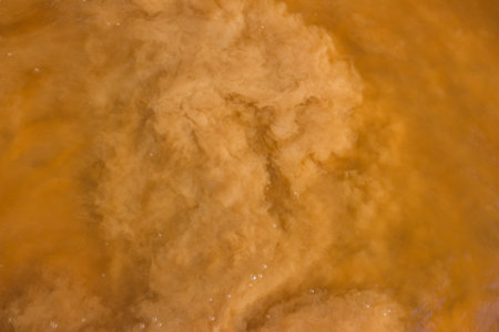 Sand raised from the bottom of a reservoir, muddy water in a river