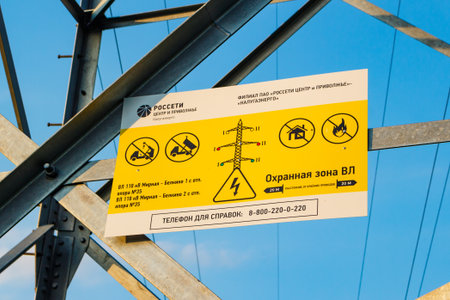 Information sign of the Rosseti company on a high-voltage transmission line support: Russia - July...