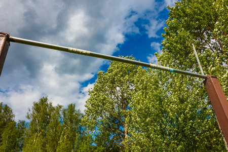 Outdoor pull-up bar wrapped with electrical tape for better grip