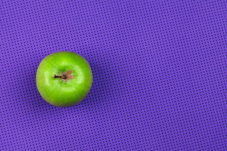 purple yoga mat and green apple