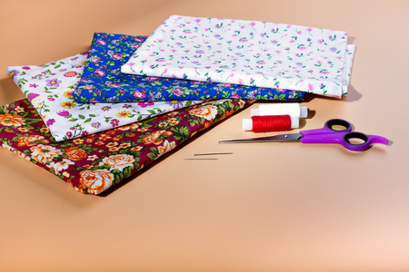 A variety of colored fabrics. Cotton, calico, chintz. Needlework. Handmade, thread, buttons,...