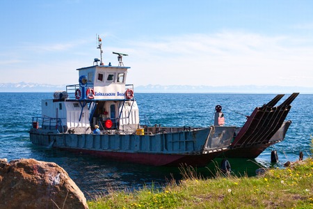 ferry "Baikal water" at Lake Baikal Siberia, Russia. 06/11/2013 Port Baikal, Listvyanka. Water transport . Blue sky and water on a summer day.のeditorial素材