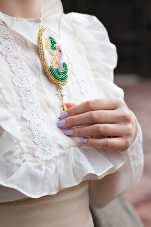 Beautiful young woman in a dress in retro style portrait. Vogue Clothing in vintage styleの写真素材