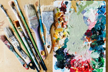 Brushes with palette in the creative background. Colorful element.の写真素材