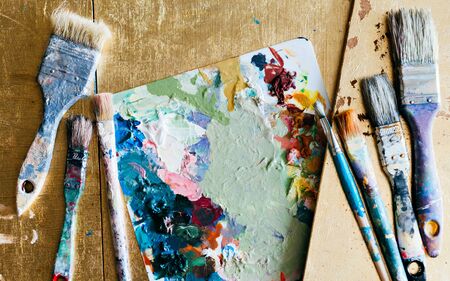 Brushes with palette in the creative background. Colorful element.の写真素材