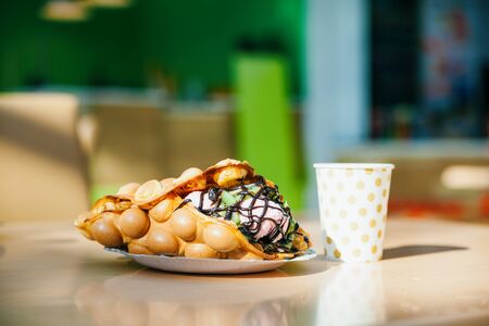 The Hong Kong waffles and paper coffee cupの写真素材