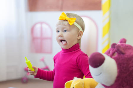 Adorable little girl with penの写真素材