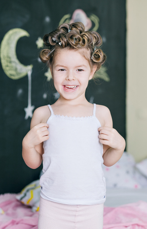 Cheerful girl stretching in the morningの写真素材