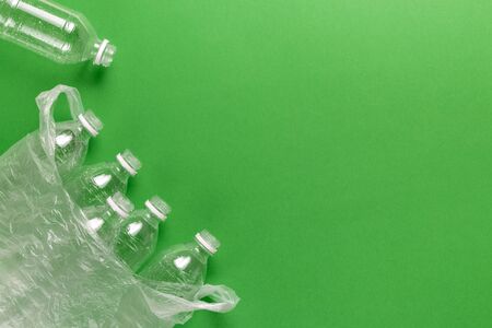 Composition of plastic waste pollution. Sorting and recycling. Disposable plastic bottles for water. Ecological concept. Flat lay, top view, copy space.の写真素材
