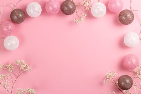 Composition for Valentines Day February 14th. Delicate pink background and garland. Greeting card, wedding or birthday composition. Flat lay, top view, copy space.の写真素材