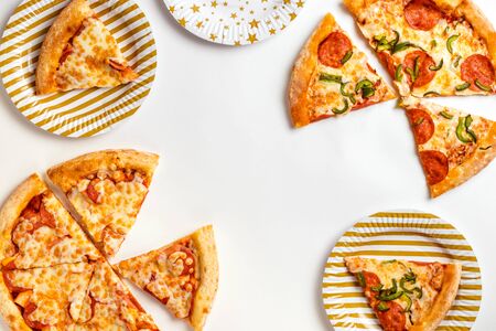 Slices of delicious fresh pizza with pepperoni and cheese on a white plate. Birthday with junk food....