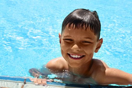 Cheery boy in the poolの写真素材