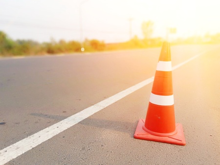 Red rubber cone placed on the road to ensure safetyの写真素材