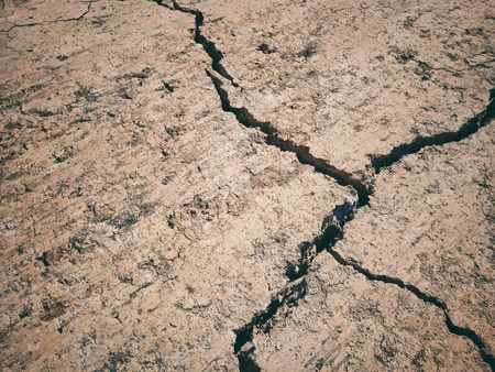 The abstract ground is a crack from the lack of water.の写真素材