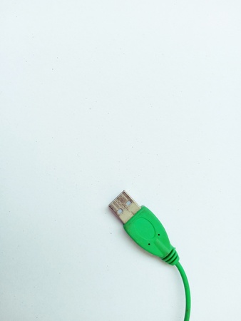 USB green cable placed on a green tableの写真素材