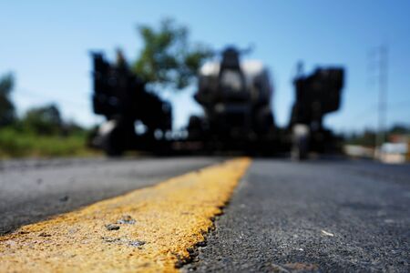 Yellow traffic paint Is a line of sight, blurred imageの写真素材