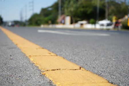 Yellow traffic paint Is a line of sight, blurred imageの写真素材