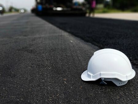 White hat and road construction (picture blurred)