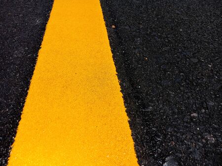 Yellow traffic line in Thailandの写真素材