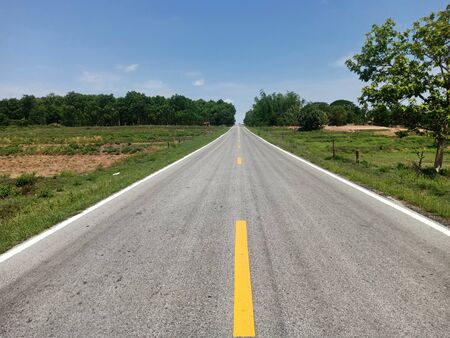 The country road beside is a rice field.