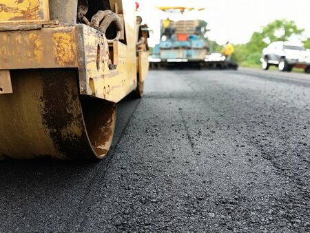 Blur image, asphalt paving With heavy machinery in Thailand
