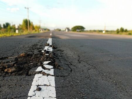 Damaged cracks in the road Dangerous for traffic