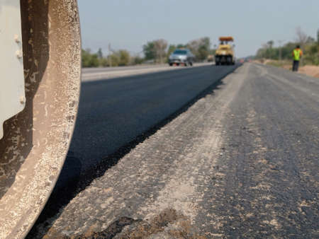 The image is blurred in the construction of paved roads. By heavy machinery