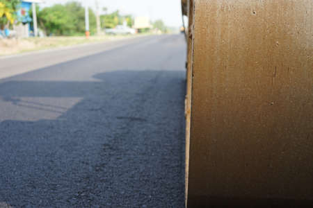 The image is blurred in the construction of paved roads. By heavy machinery