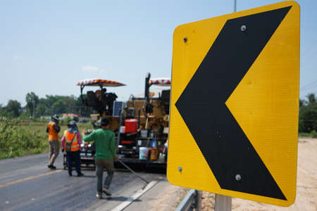 The image is blurred in the construction of paved roads. By heavy machinery