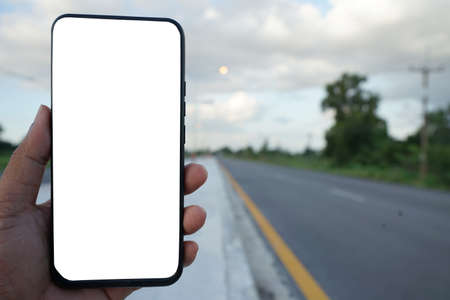 smartphone and road Use to add text to remind you to drive safely.の写真素材