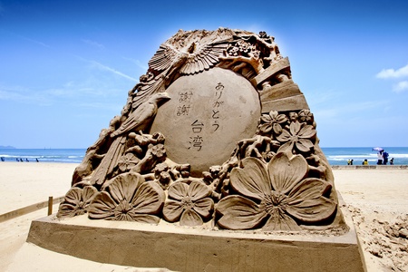 Fulong,Taiwan-May31:a blessing sand sculpture at Fulong beach for celebrating the Sand Sculpture Festival on May 31,2011 in Fulong,Taiwanのeditorial素材
