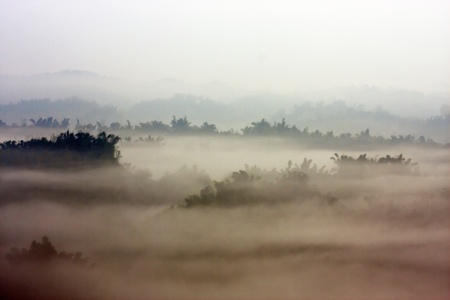 beautiful view above cloudscape and mountains as splash-ink paintingの写真素材