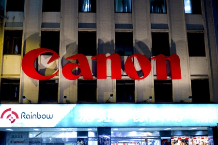 canon sign on a store shining at nightのeditorial素材