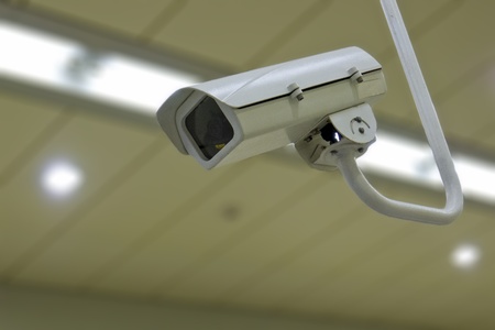 security camera on wall in public spaceの写真素材