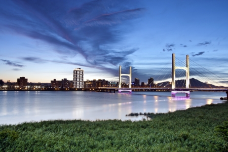 beautiful scenic of sunset with modern chongyang bridge in Taiwan in summerの写真素材