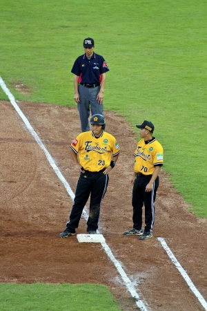 Tianmu, Taiwan - September 1,2012 : Peng, a Brother Elephants player of CPBL, get on first base for the Chinese Professional Baseball League game on September 1, 2012 at Tianmu Stadium, Taipei, Taiwan.のeditorial素材