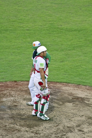 Tianmu, Taiwan - September 1,2012 : Tseng, a Sinon Buls catcher of CPBL, talk to the pitcher for the Chinese Professional Baseball League game on September 1, 2012 at Tianmu Stadium, Taipei, Taiwan.のeditorial素材