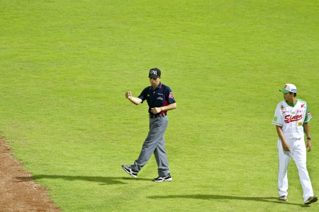 Tianmu, Taiwan - September 1,2012 :  a referee of CPBL, judge out for the Chinese Professional Baseball League game on September 1, 2012 at Tianmu Stadium, Taipei, Taiwan.のeditorial素材