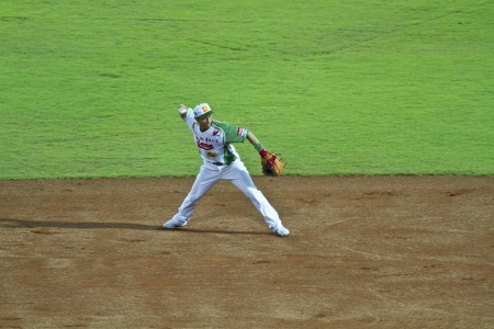 Tianmu, Taiwan - September 1,2012 : Tseng, a Sinon Bulls player of CPBL, throw the baseball to first base for the Chinese Professional Baseball League game on September 1, 2012 at Tianmu Stadium, Taipei, Taiwan.のeditorial素材