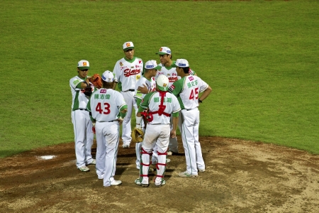 Tianmu, Taiwan - September 1,2012 : Sinon Bulls players of CPBL, call time on pitcher hill for the Chinese Professional Baseball League game on September 1, 2012 at Tianmu Stadium, Taipei, Taiwan.のeditorial素材