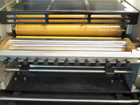Closeup of printng machine working part with white lightの写真素材
