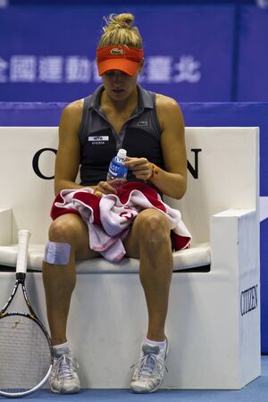 TAIPEI,TAIWAN -October 31,2012:AUS player Monique Adamczak in 2012 OEC Cup Taipei WTA Ladies Open Tennis Game in Taipei Arena on October 31,2012 in Taipei,Taiwanのeditorial素材