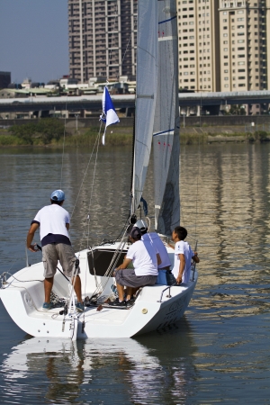 TAIPEI,TAIWAN -November 10,2012:Keel Boat Sailing on river in 2012 Taipei Keel Boat Competition in Dadaocheng Wharf on November 10,2012 in Taipei,Taiwanのeditorial素材