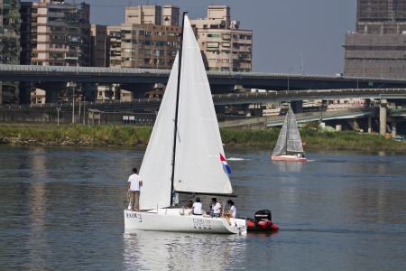 TAIPEI,TAIWAN -November 10,2012:Keel Boat Sailing on river in 2012 Taipei Keel Boat Competition in Dadaocheng Wharf on November 10,2012 in Taipei,Taiwanのeditorial素材