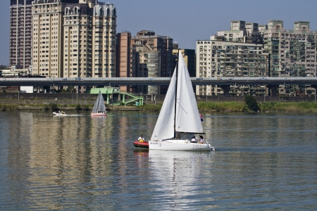 TAIPEI,TAIWAN -November 10,2012:Keel Boat Sailing on river in 2012 Taipei Keel Boat Competition in Dadaocheng Wharf on November 10,2012 in Taipei,Taiwanのeditorial素材