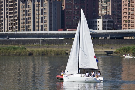 TAIPEI,TAIWAN -November 10,2012:Keel Boat Sailing on river in 2012 Taipei Keel Boat Competition in Dadaocheng Wharf on November 10,2012 in Taipei,Taiwanのeditorial素材