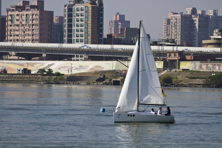TAIPEI,TAIWAN -November 10,2012:Keel Boat Sailing on river in 2012 Taipei Keel Boat Competition in Dadaocheng Wharf on November 10,2012 in Taipei,Taiwanのeditorial素材