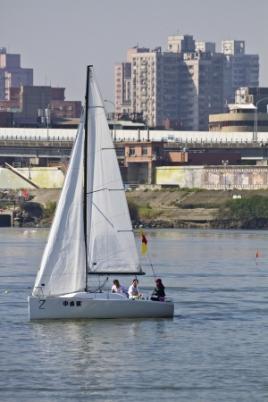 TAIPEI,TAIWAN -November 10,2012:Keel Boat Sailing on river in 2012 Taipei Keel Boat Competition in Dadaocheng Wharf on November 10,2012 in Taipei,Taiwanのeditorial素材