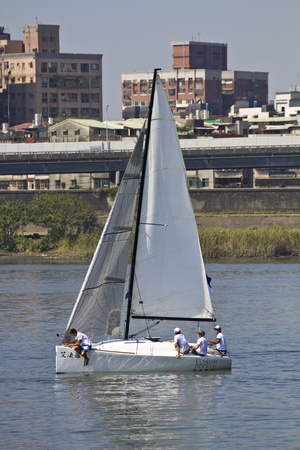 TAIPEI,TAIWAN -November 10,2012:Keel Boat Sailing on river in 2012 Taipei Keel Boat Competition in Dadaocheng Wharf on November 10,2012 in Taipei,Taiwanのeditorial素材