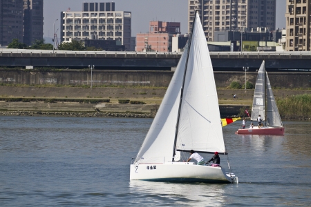 TAIPEI,TAIWAN -November 10,2012:Keel Boat Sailing on river in 2012 Taipei Keel Boat Competition in Dadaocheng Wharf on November 10,2012 in Taipei,Taiwanのeditorial素材